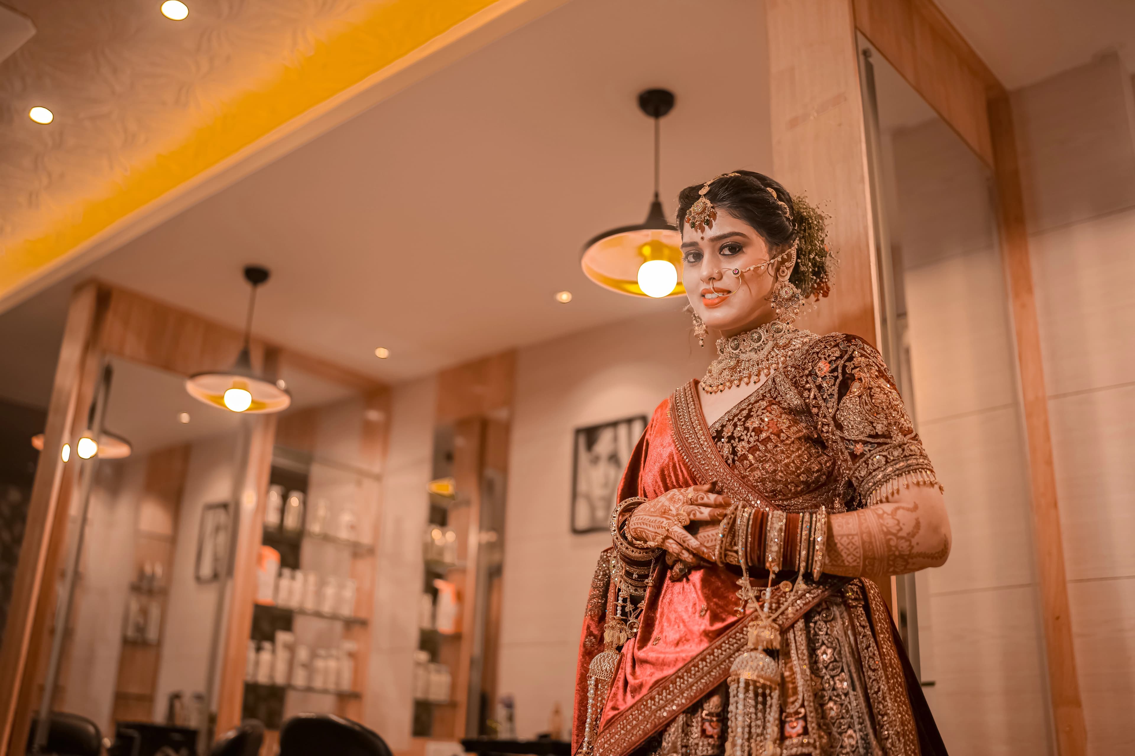 A stunning bride adorned in a vibrant traditional Indian outfit, radiating joy and elegance on her special day