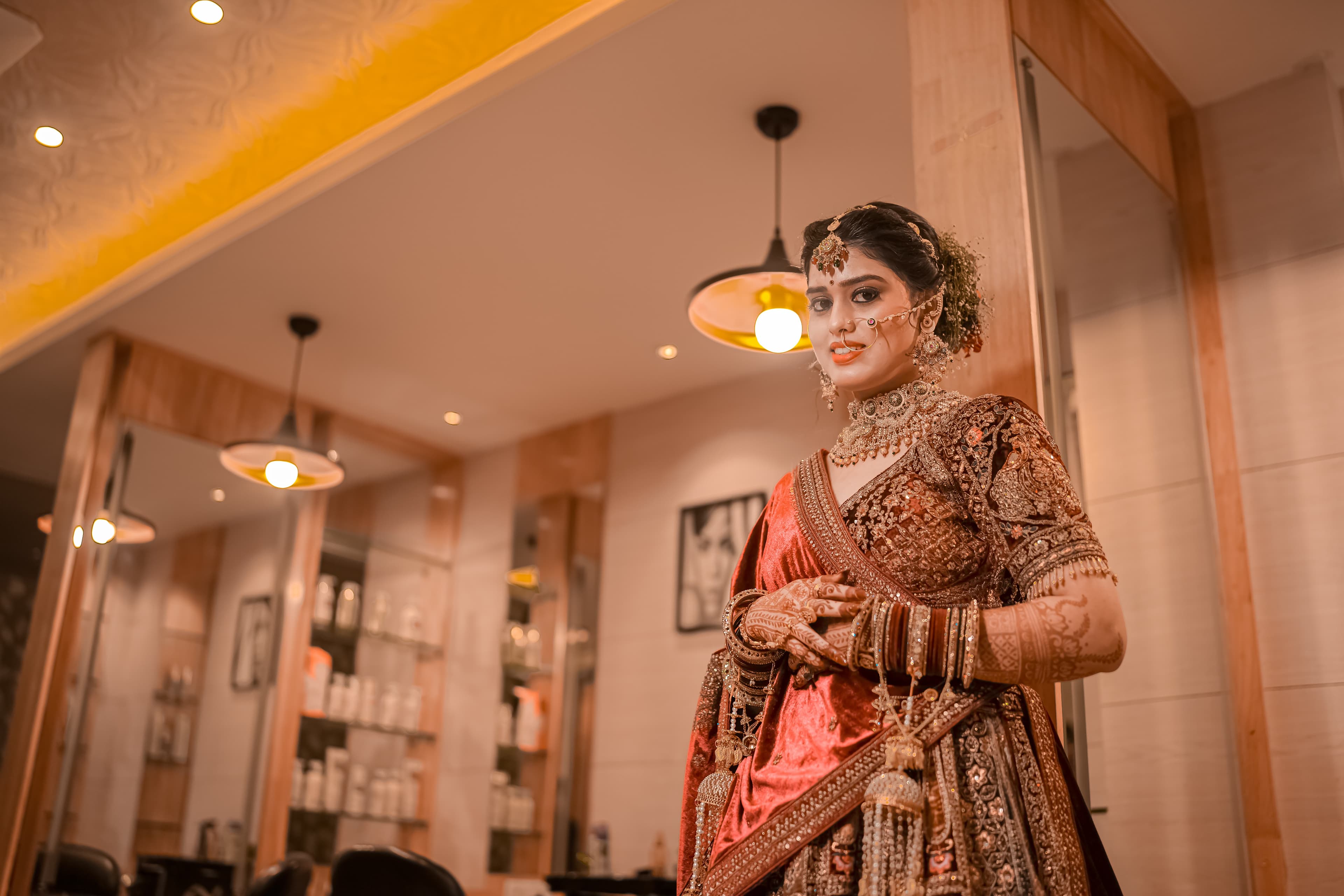 A stunning bride adorned in a vibrant traditional Indian outfit, radiating joy and elegance on her special day