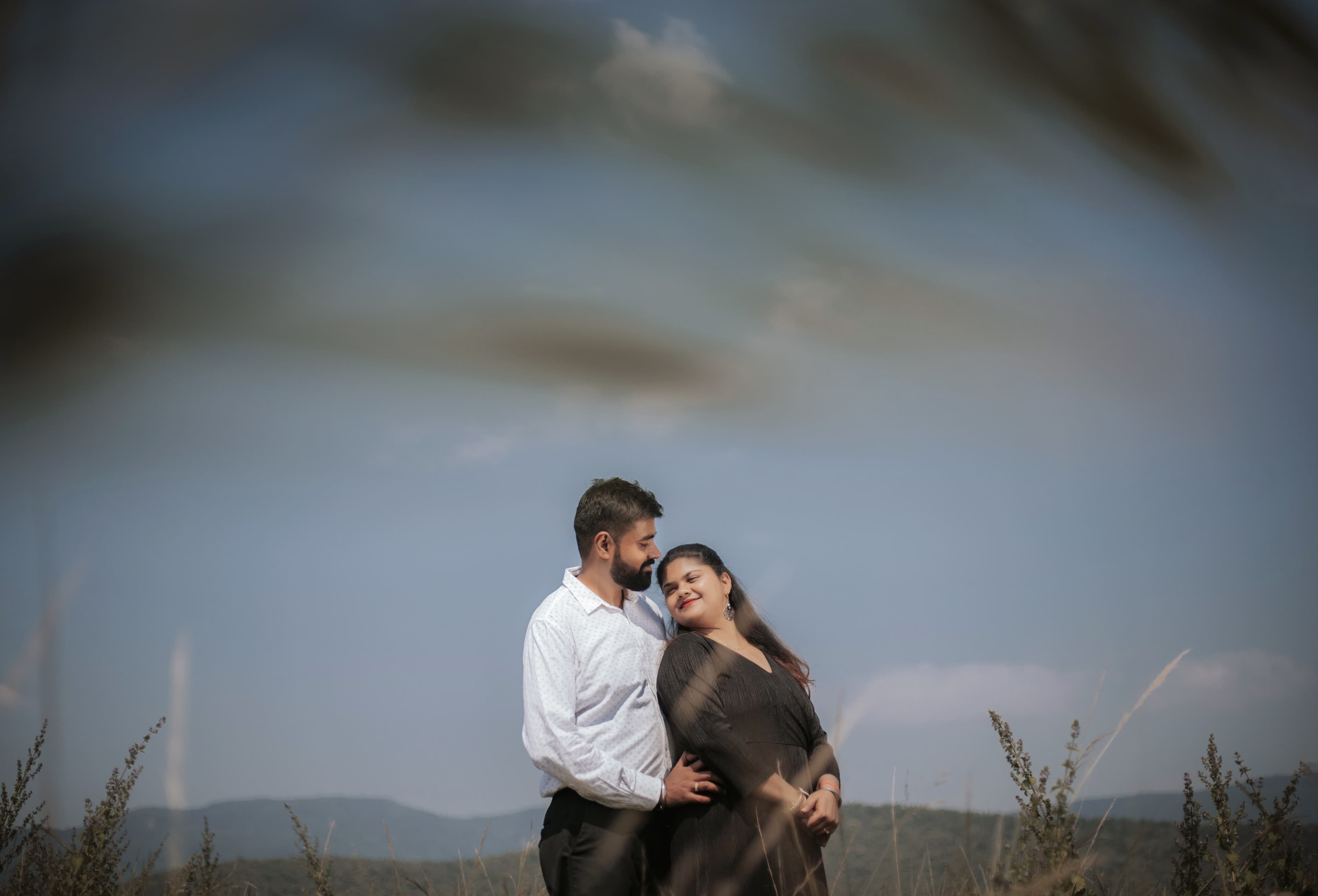 Couple laughing together in pre-wedding session at a serene Jamshedpur location