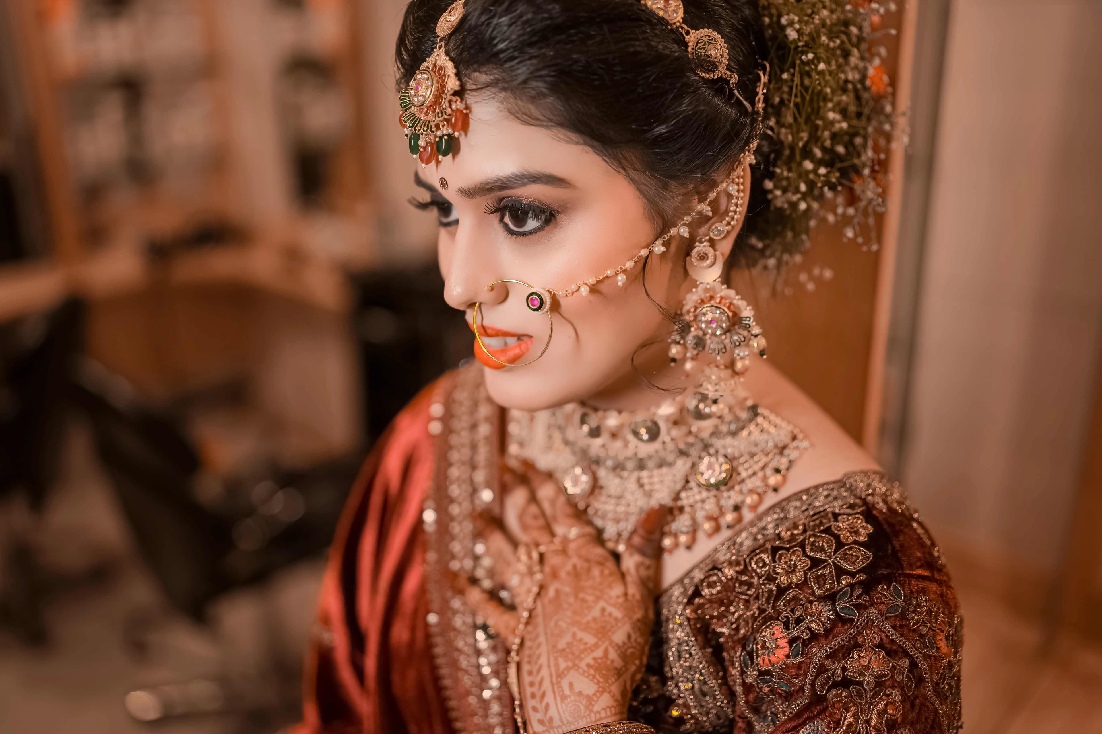 A lovely bride adorned in traditional Indian attire, embodying grace and beauty as she prepares for her wedding celebration
